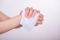 Fingers hold wet wipes and cleaning hands Royalty Free Stock Photo