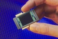 Fingers holding a microprocessor chip