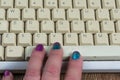 Fingers on keyboard spacebar