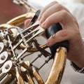 The fingers of the musician playing the French horn Royalty Free Stock Photo