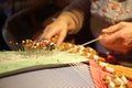 fingers of an octogenarian creating bobbin lace Royalty Free Stock Photo