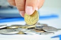 Fingers picking up a coin - one Australian dollar(AUD) Royalty Free Stock Photo