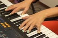 Fingers playing electronic piano keyboards Royalty Free Stock Photo