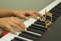 Fingers playing electronic piano keyboards Royalty Free Stock Photo