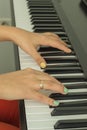 Fingers playing electronic piano keyboards Royalty Free Stock Photo