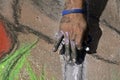 Fingers of a sidewalk chalk artist