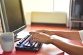 Fingers to keyboard on the laptop to working from home with business communications working with selective focus on Royalty Free Stock Photo