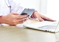 Fingers to keyboard on the laptop to working from home with business communications working with selective focus on Royalty Free Stock Photo