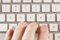 Fingers Typing on a Computer Keyboard Royalty Free Stock Photo