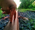 The fingers walk on railway track