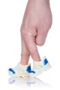 Fingers wearing sports trainers