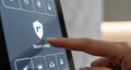 Finger touching security armed icon on smart home control panel for home safety Royalty Free Stock Photo