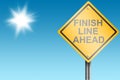 Finish line ahead street sign with blue sky Royalty Free Stock Photo