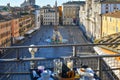 A finished breakfast table overlooking Piazza Navona from a rooftop cafe in Rome Italy