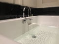 Finished Ceramic made bathtub with chrome plated sanitary fittings for an bathroom at Five star hotel during quarantine facility
