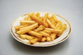 The finished fries are on a plate sprinkled with seasoning Royalty Free Stock Photo