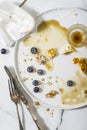 Finished meal, pancakes with blueberries and coffee. Table top view Royalty Free Stock Photo