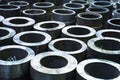 Finished metal cylindrical tubular pipe products in metal processing plant Royalty Free Stock Photo