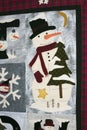 Finished quilt showing snowman.