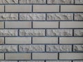 Finishing bricks for walls. Smooth and chipped. Gray background. Exterior Royalty Free Stock Photo