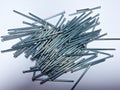 Finishing galvanized nails for high-quality fasteners of such materials as skirting boards, shtapik, parquet, platbands lining Royalty Free Stock Photo