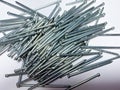 Finishing galvanized nails for high-quality fasteners of such materials as skirting boards, shtapik, parquet, platbands lining Royalty Free Stock Photo