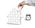 Finishing to assemble house shape puzzles with alarm clock