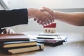 Finishing to successful deal of real estate, Broker and client shaking hands after signing contract approved application form, Royalty Free Stock Photo