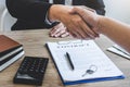 Finishing to successful deal of real estate, Broker and client shaking hands after signing contract approved application form, Royalty Free Stock Photo