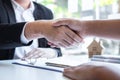 Finishing to successful deal of real estate, Broker and client shaking hands after signing contract approved application form, Royalty Free Stock Photo