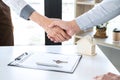 Finishing to successful deal of real estate, Broker and client shaking hands after signing contract approved application form, Royalty Free Stock Photo