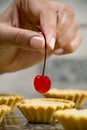 Finishing touch with cherry Royalty Free Stock Photo