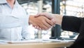 Finishing up a conversation after collaboration, handshake of two business people after contract agreement to become a partner, Royalty Free Stock Photo