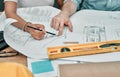 Finishing up a few blueprints. Closeup shot of two architects working with blueprints in an office. Royalty Free Stock Photo