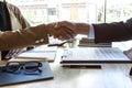 Finishing up a meeting, handshake of two happy business people after contract agreement to become a partner, collaborative Royalty Free Stock Photo