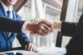 Finishing up a meeting, handshake of two happy business people after contract agreement to become a partner, collaborative Royalty Free Stock Photo