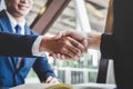 Finishing up a meeting, handshake of two happy business people after contract agreement to become a partner, collaborative Royalty Free Stock Photo