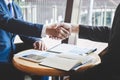 Finishing up a meeting, handshake of two happy business people after contract agreement to become a partner, collaborative Royalty Free Stock Photo