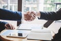 Finishing up a meeting, handshake of two happy business people after contract agreement to become a partner, collaborative Royalty Free Stock Photo