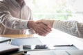 Finishing up a meeting, handshake of two happy business people after contract agreement to become a partner, collaborative Royalty Free Stock Photo