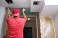 Filling walls and assembly and gluing gypsum boards during renovation of a room.