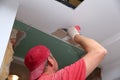 Filling walls and assembly and gluing gypsum boards during renovation of a room.