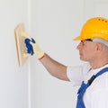 Finishing works at wall Royalty Free Stock Photo