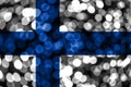 Finland abstract blurry bokeh flag. Christmas, New Year and National day concept flag