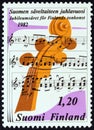 FINLAND - CIRCA 1982: A stamp printed in Finland shows Musical notation and Peghead of a stringed instrument, circa 1982. Royalty Free Stock Photo