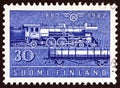 FINLAND - CIRCA 1962: A stamp printed in Finland shows Class Hr-1 steam locomotive and Type Hk wagon, circa 1962.