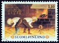 FINLAND - CIRCA 1980: A stamp printed in Finland shows To put out the shoe maker`s eye children`s game, circa 1980.