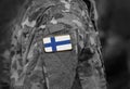 Finland flag on soldiers arm collage Royalty Free Stock Photo