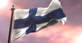 Finland flag waving at wind at sunset, loop