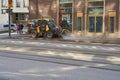Finland. Helsinki. April 15, 2021 A mini tractor washes the sidewalk. Public cleaning concept